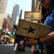 A woman displays her Hamilton autograph book outside the popular Broadway show Hamilton on June 21, 2016, in New York City.
Spencer Platt/Getty Images